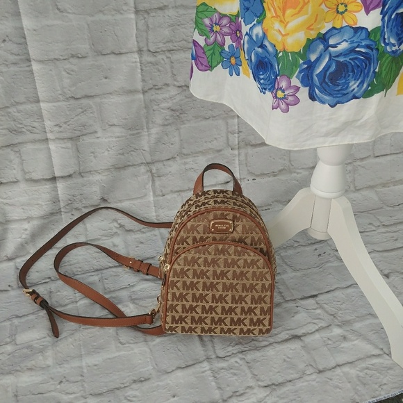 Michael Kors Handbags - Michael Kors Abbey Mini Backpack bag xs brown tan